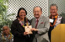 Jari Sugano accepting award and Farm Bureau convention